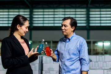 Customer visits a warehouse or factory in order to drink purchase decision. Owner explaining Products to customer. Checking goods quality for import and export. Drink factory production line beverage