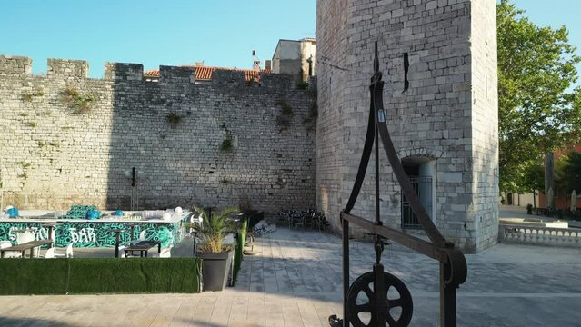 Zadar's wells are famous. An aerial footage on the Five Wells square over Captains Tower and red rooftops of the city. Croatia in morning calm
