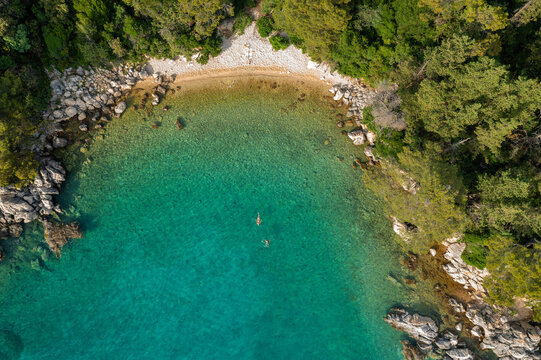 Aerial view of the rocky and forested coast of Rab Island, the Adriatic Sea in Croatia