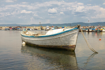 Fototapeta premium Old wooden fishing boat in port of nessebar, ancient city on the Black Sea coast of Bulgaria