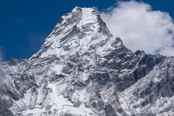 Ama Dablam is one of the most beautiful mountains in the world standing at an elevation of 6,812 metres (22,349 ft). Mother's necklace or Ama dablam mountain seeing from Ama Dablam base camp in Nepal.
