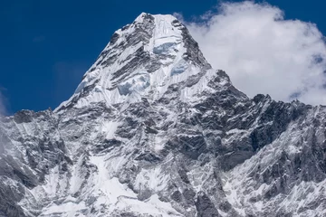 Fotobehang Ama Dablam Ama Dablam is one of the most beautiful mountains in the world standing at an elevation of 6,812 metres (22,349 ft). Mother's necklace or Ama dablam mountain seeing from Ama Dablam base camp in Nepal.