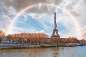 Paris Eiffel Tower and river Seine with amazing rainbow - Paris, France. Eiffel Tower is one of the...