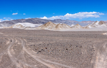 Puna - off road adventure on the way to the Campo de Piedra Pómez, a bizarre but beautiful landscape with a field of pumice, volcanic rocks and dunes of sand in the north of Argentina, South America 