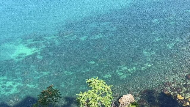 Blue ocean transparent surface aerial view.