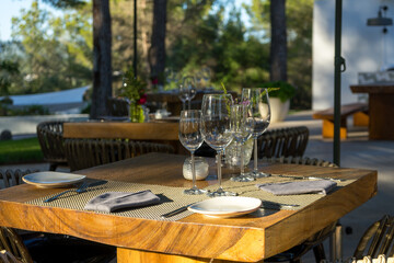 Sunset table for two set for dinner at Mediterranean restaurant. Love and romance.