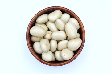 Jackfruit seeds in a wooden bowl top view 