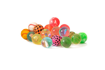 A lot of rubber balls, of all colors. Isolated on a white background. The ideal fun for children and cats.