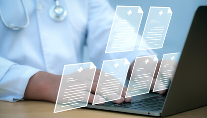 A medical worker works with an electronic database and documents.Technology and access information,...