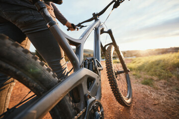 Sports, mountain bike and closeup of bicycle in nature for hobby, workout and exercise in...