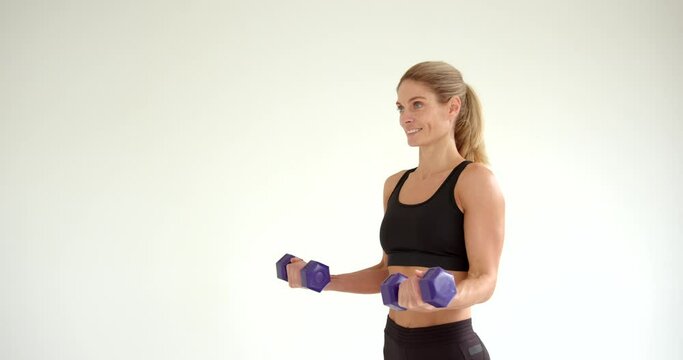 Young woman doing workout on fitness mat