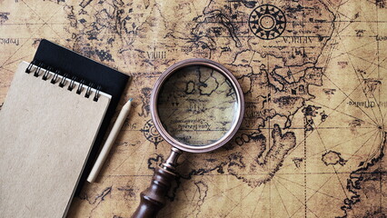 Magnifying glass and an ancient old map,Old map with an magnifying glass