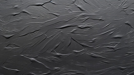 Obraz premium Black colored surface in the style of use of paper
