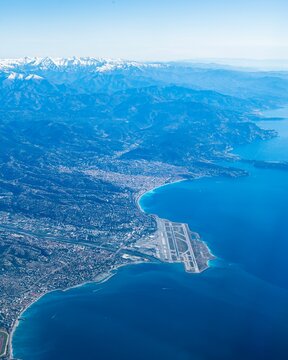 Amazing view of Nice Cote d'azur airport and Nice town along with the french riviera and the alps taken from an airplane window 
