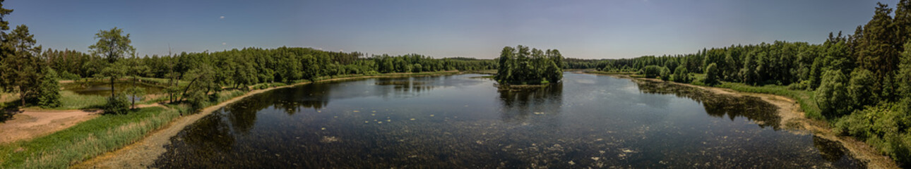 Aerial panorama of the lake in the forest in Podlasie,Poland on a sunny,spring  day.