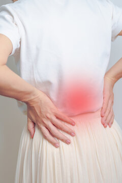 Woman having back pain. Urinary system and Stones, Kidney Cancer, world kidney day, Chronic kidney stomach, liver pain and pancreas concept