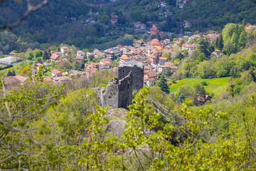 Fototapeta na wymiar Aerial view of the ruins of the castle of Savignone in the Ligurian hinterland of Genoa, Italy