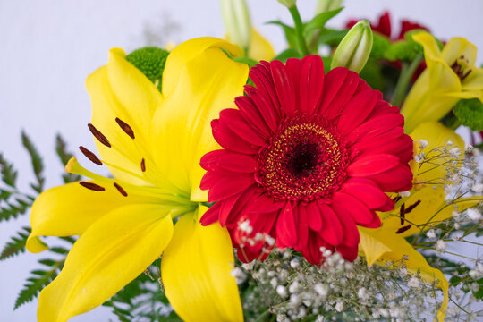 Valentine's Day Women's Day birthday celebration. Close up cropped photo of bouquet of flowers, red and yellow color