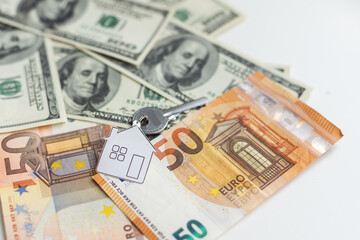 Obraz na płótnie Canvas Keys on background of money. Buying and renting concepts