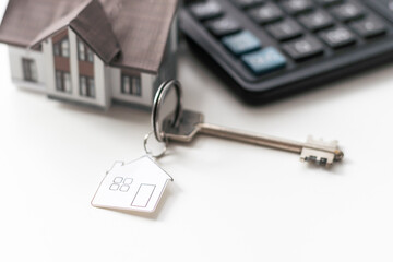 Money concept. White calculator with euro banknotes 