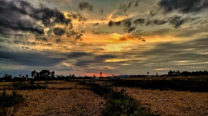 Reddish sky in the afternoon and thin dark clouds