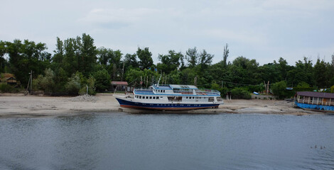 a ship on the bank of a dry river, a ship aground