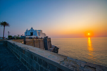 Sunset in Forio d'Ischia with sea and Chiesa del Soccorso - obrazy, fototapety, plakaty