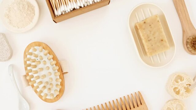 Natural skin care products. Zero waste, eco friendly bathroom and spa accessories. Personal care supplies: wooden comb, brush, toothbrush, soap in handmade. Beauty SPA branding mockup. 4k