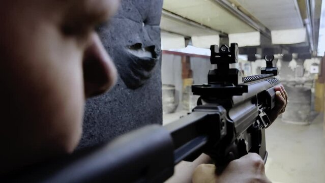 Woman Shooting with a Assault Rifle in Shooting Range in Switzerland. (Audio)