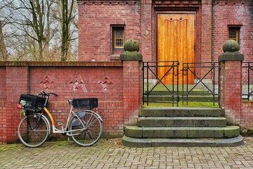 old bicycle in front of wall