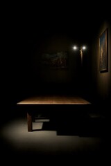 A Wooden Table In A Dark Room With A Painting On The Wall