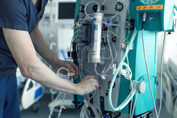 medical equipment in the intensive care unit in the hospital, a ventilator, a technician adjusts the equipment in intensive care