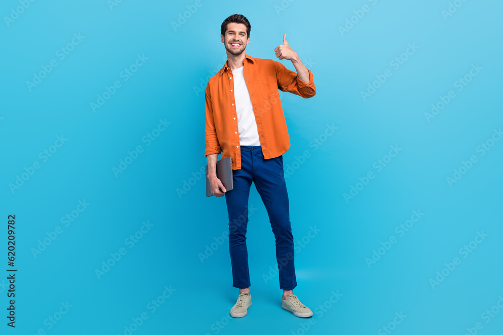 Poster full size portrait of positive attractive person arm hold netbook demonstrate thumb up approval isol