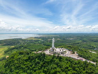 Aerial view of Our lady of Lourdes Virgin Mary catholic religious statue on a Nui Cui mountain in Dong Nai province, Vietnam.