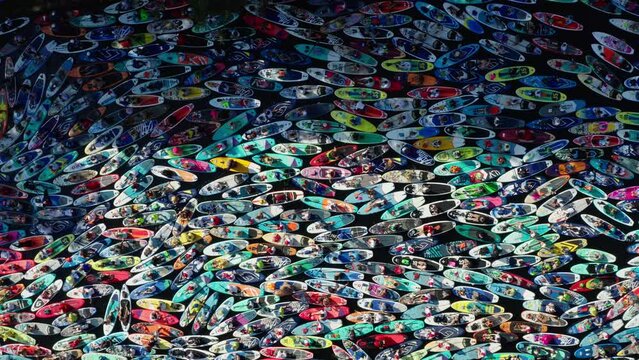 St. Petersburg, summer 2022:A lot of people on paddle boards on the water during festival fontanka SUP, top down aerial view. Panoramic aerial view.