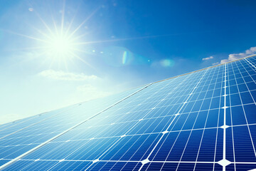 Solar panels reflect sparkling light From the sun on blue sky background, Clean energy, and good...