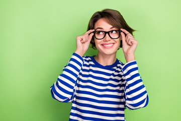 Photo of dreamy woman with bob hairstyle sailor shirt touching eyewear look at offer empty space...