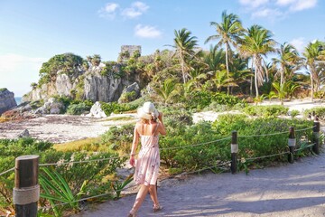 blonde woman in tulum ruin in mexico - obrazy, fototapety, plakaty