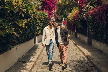 couple walking kissing and huging in the city