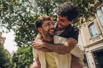 couple walking kissing and huging in the city