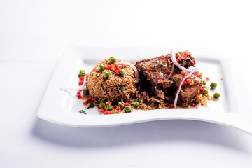 ARROZ CON PATO, RICE WITH DUCK, PERUVIAN GASTRONOMY DISH 