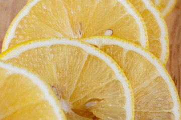 Yellow ripe lemon cut into slices