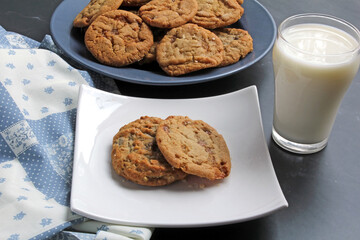 A snack of toffee cookies and milk
