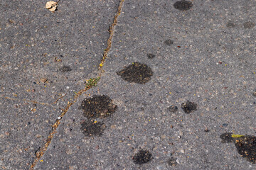 part of the paved road is blocked with waste from cars