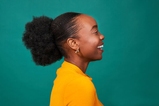 Profile Of Beautiful Black Woman, Studio Teal Background, Fashion Portrait