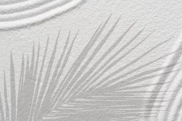 Fotobehang Zen Stenen Zen garden white sand with palm leaves shadow on line pattern in Japanese style, Sand texture surface with wave parallel lines,Background Spa Therapy,Purity harmony,Balance,Meditation,Zen like concept  © Anchalee