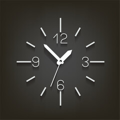 white wall clock timer with shadow on dark