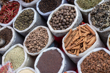 Assorted spices, condiments and flavorings at Goa commerce. Grounded, whole, sugary and burning seasonings on sale.