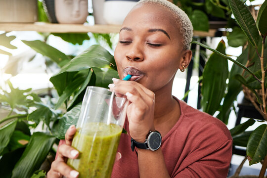 Health, diet and drink with black woman and smoothie for detox, breakfast and protein. Nutrition, food and weight loss with face of person and glass for green juice, vitamins and supplement