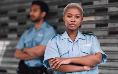 Portrait, security or law enforcement and a serious woman arms crossed with a man colleague on the street. Safety. focus and duty with a crime prevention unity working as a team in an urban city